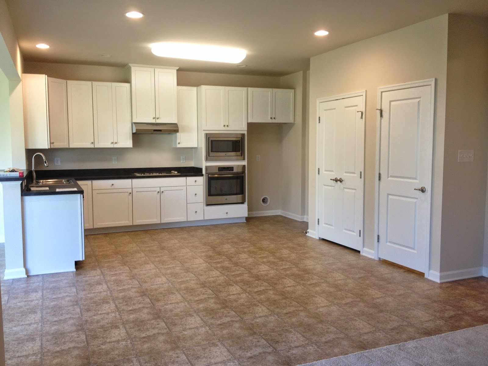 ryan homes hardwood floor options of road to palermo within kitchen showing pantry left and door to basement